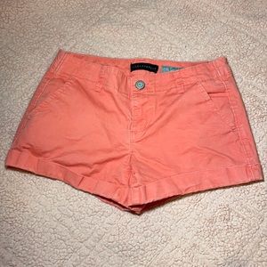 Dark peach jean shorts.
